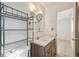 Simple bathroom with vanity, shelving, and toilet at 122 Alvina Ave, Lake Wales, FL 33853