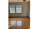 Empty bedroom with light walls and wood-look flooring at 1322 Shady Cove W Rd, Haines City, FL 33844