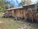 Long wooden home with multiple entrances and yard at 1322 Shady Cove W Rd, Haines City, FL 33844