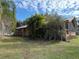 Long wooden home with a screened porch at 1322 Shady Cove W Rd, Haines City, FL 33844