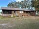 Ranch-style home with screened porch and large yard at 1322 Shady Cove W Rd, Haines City, FL 33844