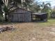 Wooden garage and covered carport at 1322 Shady Cove W Rd, Haines City, FL 33844