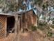 Wooden garage and covered area with lattice at 1322 Shady Cove W Rd, Haines City, FL 33844