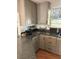 Kitchen with gray cabinets and granite countertops at 1322 Shady Cove W Rd, Haines City, FL 33844