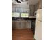 Kitchen with gray cabinets and stainless steel appliances at 1322 Shady Cove W Rd, Haines City, FL 33844