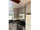 Kitchen with gray cabinets, stainless steel appliances, and granite countertops at 1322 Shady Cove W Rd, Haines City, FL 33844