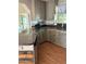 L-shaped kitchen with gray cabinets and granite countertops at 1322 Shady Cove W Rd, Haines City, FL 33844