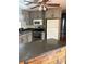 Kitchen with gray cabinets, stainless steel appliances, and a wood counter at 1322 Shady Cove W Rd, Haines City, FL 33844