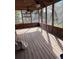 Spacious screened porch with wooden deck and pool view at 1322 Shady Cove W Rd, Haines City, FL 33844