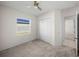 Well-lit bedroom with double-door closet and neutral wall color at 1340 Oakmont Dr, Winter Haven, FL 33884