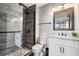 Updated bathroom with a walk-in shower and granite countertop at 1591 Forest Hills Ln, Haines City, FL 33844