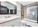 Clean bathroom, featuring a bathtub and granite countertop at 1591 Forest Hills Ln, Haines City, FL 33844