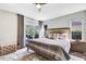 Serene bedroom with a king-size bed and access to a patio at 1591 Forest Hills Ln, Haines City, FL 33844