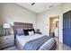 Bright bedroom with a comfortable bed and ensuite bathroom at 1591 Forest Hills Ln, Haines City, FL 33844