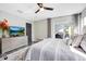 Main bedroom with king bed, private patio access, and TV at 1591 Forest Hills Ln, Haines City, FL 33844