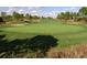 Aerial view of a lush green golf course with sand traps at 1591 Forest Hills Ln, Haines City, FL 33844