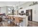 Modern kitchen with white cabinets, granite countertops, and island at 1591 Forest Hills Ln, Haines City, FL 33844