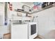 Convenient laundry room with washer, dryer, and ample storage at 1591 Forest Hills Ln, Haines City, FL 33844