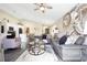 Bright living room featuring stylish furniture and large artwork at 1591 Forest Hills Ln, Haines City, FL 33844