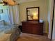 Bedroom with dresser and a double bed at 161 Bonnie Dr, Auburndale, FL 33823