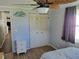 Bright bedroom with double doors and ceiling fan at 161 Bonnie Dr, Auburndale, FL 33823