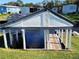 Waterfront boat house with wooden dock at 161 Bonnie Dr, Auburndale, FL 33823