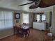 Dining room with wooden table and white cabinets at 161 Bonnie Dr, Auburndale, FL 33823