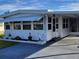 Front view of the home with landscaping at 161 Bonnie Dr, Auburndale, FL 33823