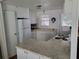 White kitchen with granite countertops and appliances at 161 Bonnie Dr, Auburndale, FL 33823