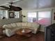 Living area featuring a sectional sofa and wood-look flooring at 161 Bonnie Dr, Auburndale, FL 33823