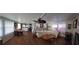 Open living space with a sectional sofa, dining table, and kitchen peek at 161 Bonnie Dr, Auburndale, FL 33823