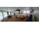 Spacious living room with light brown flooring, sectional sofa, and dining area at 161 Bonnie Dr, Auburndale, FL 33823
