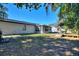 Large backyard with screened patio, deck, and above-ground pool at 1610 Meadow Ne Ln, Winter Haven, FL 33881