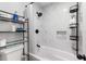 Clean bathroom with a bathtub and marble tile shower surround at 1610 Meadow Ne Ln, Winter Haven, FL 33881