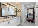 Modern bathroom with double vanity and granite countertops at 1610 Meadow Ne Ln, Winter Haven, FL 33881