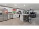 Modern kitchen with stainless steel appliances, granite countertops, and an island at 1610 Meadow Ne Ln, Winter Haven, FL 33881