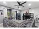 Cozy living room featuring a large sectional sofa and built-in entertainment center at 1610 Meadow Ne Ln, Winter Haven, FL 33881