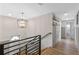 Modern staircase with metal railing and light fixture at 1814 Lake Ariana Blvd, Auburndale, FL 33823