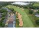 Aerial perspective of a golf course with surrounding houses at 2060 Hemingway Ave, Haines City, FL 33844