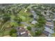 Wide aerial view of a golf course community with various houses at 2060 Hemingway Ave, Haines City, FL 33844