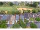 Aerial view of a house with a pool, located in a golf course community at 2060 Hemingway Ave, Haines City, FL 33844