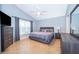 Spacious bedroom with large window, tiled floors and plenty of dresser space at 2060 Hemingway Ave, Haines City, FL 33844