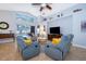 Comfortable living room with two recliners and a large TV at 2060 Hemingway Ave, Haines City, FL 33844