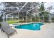 Inviting freeform pool with spa and screened enclosure at 2060 Hemingway Ave, Haines City, FL 33844