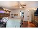 Cozy bedroom with wood flooring and built-in shelving at 2419 Trenton E Rd, Lakeland, FL 33815