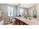 Bathroom with double vanity and a walk-in shower at 2556 Ladoga Dr, Lakeland, FL 33805