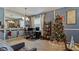 Spacious living room with a home office, Christmas tree, and comfortable seating at 2556 Ladoga Dr, Lakeland, FL 33805