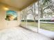 Screened porch with tiled floor, sliding doors and backyard access at 2985 Pinnacle Ct, Clermont, FL 34711