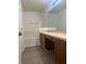 Main bathroom with double vanity and a relaxing bathtub at 3111 Wentworth Ln, Kissimmee, FL 34741