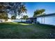 Spacious backyard with covered patio and fenced perimeter at 315 Lauderdale Ct, Kissimmee, FL 34759
